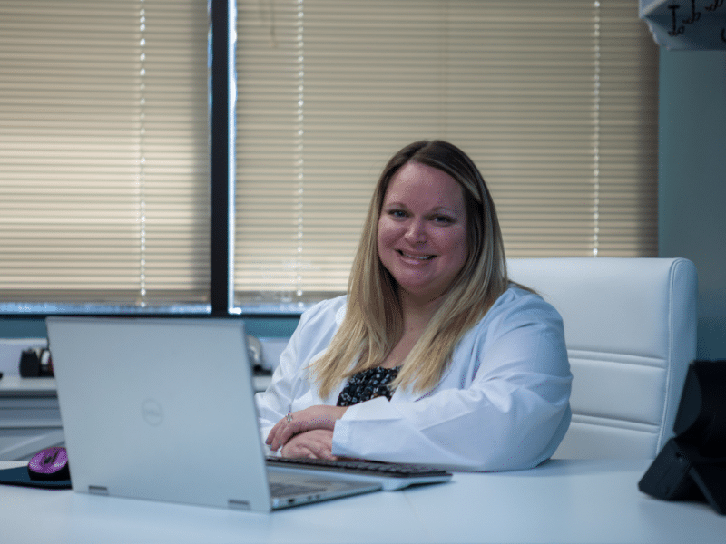 Dr Burkes sitting at her desk